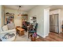 Cozy sitting area with built-in bookshelves and a view into the kitchen at 3133 Lake Pine Way # D1, Tarpon Springs, FL 34688