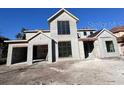 Two-story house with light gray exterior and large windows at 3403 W Leona St, Tampa, FL 33629