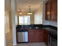 The kitchen is equipped with stainless steel appliances and lovely countertops at 8504 Brushleaf Way, Tampa, FL 33647