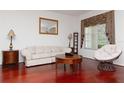 Living room with hardwood floors, and neutral colored furniture at 4224 Fleewell Ct, Valrico, FL 33596