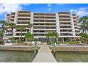 Building exterior showcasing water access and landscaping at 5700 Mariner St # 801E, Tampa, FL 33609