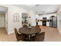 Kitchen dining area with a round table and four chairs at 2944 Prairie Iris Dr, Land O Lakes, FL 34638