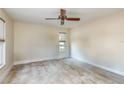 Spacious bedroom with wood flooring and ceiling fan at 2966 Macalpin N Dr, Palm Harbor, FL 34684