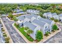 Aerial view of townhome community and neighborhood at 5310 Escena Ct, Tampa, FL 33611