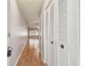 Light and bright entryway with wood flooring and built in storage at 11200 102Nd Ave # 33, Seminole, FL 33778