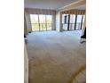 Bright living room with large windows at 8 Belleview Blvd # 408, Belleair, FL 33756