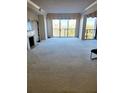 Spacious living room with fireplace and view at 8 Belleview Blvd # 408, Belleair, FL 33756