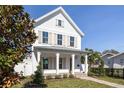 White farmhouse exterior with a covered porch and walkway at 245 12Th Ne Ave, St Petersburg, FL 33701