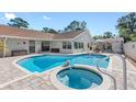 Inviting pool and spa area with ample patio space at 4608 Apple Ridge Ln, Tampa, FL 33624