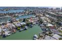 Aerial view shows home's location on the canal, with water access at 17710 Long Point Dr, Redington Shores, FL 33708