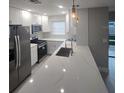 Modern kitchen with white cabinets and quartz countertops at 5980 80Th N St # 106, St Petersburg, FL 33709