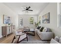 Bright and airy living room featuring hardwood floors and neutral decor at 1518 E Knollwood St, Tampa, FL 33610