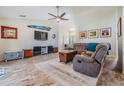 Spacious living room with tile floors, neutral walls, fan, and comfortable seating at 1002 Pondview Ct, Tarpon Springs, FL 34689