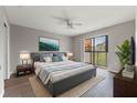 Spacious primary bedroom with private balcony access at 1662 Seascape Cir # 205, Tarpon Springs, FL 34689