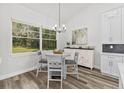 Bright breakfast nook with white cabinetry and a round table at 4586 Hickory Oak Dr, Brooksville, FL 34601