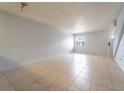 Spacious living room with tile flooring and neutral walls at 4883 W Mcelroy Ave # G211, Tampa, FL 33611