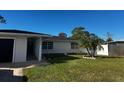 Single story home with new paint and landscaping at 4518 Helena Ne St, St Petersburg, FL 33703