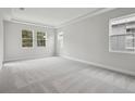 Spacious bedroom with gray carpet and multiple windows at 12823 Daleridge Pl, Riverview, FL 33579