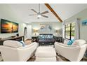 Open living room with hardwood floors and comfortable seating at 104 Cypress Pond Rd, Palm Harbor, FL 34683