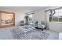 Living room features a view into the dining area at 1875 Stetson Dr, Clearwater, FL 33765