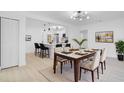 Bright dining room with table and chairs, adjacent to kitchen at 1009 Farragut N Dr, St Petersburg, FL 33710