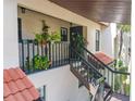 Exterior condo stairwell with lush greenery at 3505 Tarpon Woods Blvd # K409, Palm Harbor, FL 34685