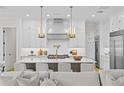 Spacious kitchen with white cabinets, large island, and stainless steel appliances at 4835 W San Jose St, Tampa, FL 33629