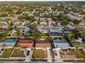 Aerial view of neighborhood homes with lush green surroundings at 1619 Coppertree Dr, Tarpon Springs, FL 34689