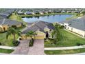 House with lake view in a residential community with similar homes at 649 Chipper Dr, Sun City Center, FL 33573