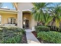 Inviting front entrance with a porch and lush landscaping at 3407 Fox Squirrel Ln, Valrico, FL 33594