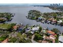 Aerial view of waterfront home with private dock and lush landscaping at 1331 Brightwaters Ne Blvd, St Petersburg, FL 33704