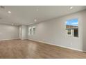 Bright living room featuring hardwood floors and recessed lighting at 6092 Timberdale Ave, Wesley Chapel, FL 33545