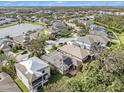 Aerial view of a house with solar panels and a neighborhood at 6232 French Creek Ct, Ellenton, FL 34222