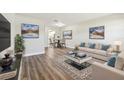 Bright living room with modern furniture and hardwood floors at 5875 21St N St # 15L, St Petersburg, FL 33714