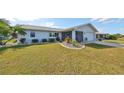 Single-story home with a well manicured lawn and driveway at 2019 N Pebble Beach Blvd, Sun City Center, FL 33573