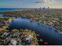 Panoramic aerial shot of a waterfront community with city views, waterways, lush landscaping, and private docks at 1100 Monterey Ne Blvd, St Petersburg, FL 33704