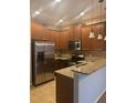 Modern kitchen with stainless steel appliances and granite countertops at 10235 Villa Palazzo Ct, Tampa, FL 33615