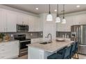 Modern kitchen with stainless steel appliances and granite countertops at 4194 Feldspar Ln, Spring Hill, FL 34609