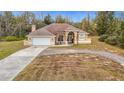 One-story home with attached garage and circular driveway at 4367 Burns Rd, Brooksville, FL 34602