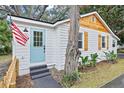 Updated home with light blue door and American flag at 3170 6Th S Ave, St Petersburg, FL 33712