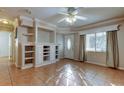 Living room with built-in shelving and tiled floors at 8495 109Th St, Seminole, FL 33772