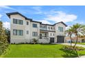 Modern home with a two-car garage and lush landscaping at 1954 Iowa Ne Ave, St Petersburg, FL 33703