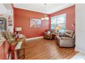 Cozy sitting area with two leather recliners and hardwood floors at 7123 Colonial Lake Dr, Riverview, FL 33578