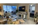 Living room with open floor plan, TV, and bedroom view at 1243 S Martin Luther King Jr Ave # B205, Clearwater, FL 33756