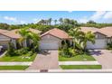 Bird's eye view of a community of single-story homes with lush landscaping at 200 Soliera St, Nokomis, FL 34275