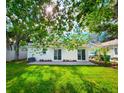 Spacious backyard featuring a lush lawn and mature trees, perfect for outdoor activities at 3915 W San Pedro St, Tampa, FL 33629