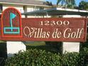 Community sign for Villas de Golf with manicured landscaping at 12300 Vonn Rd # 9105, Largo, FL 33774