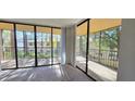 Private balcony offering tranquil views of the surrounding area at 3076 Eastland Blvd # 106, Clearwater, FL 33761