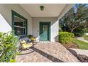 Inviting front porch with rocking chairs and brick flooring at 790 7Th Ne Ave, Largo, FL 33770