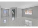 Bright and airy living room with marble-look flooring at 7214 Blossom Ave, Tampa, FL 33614